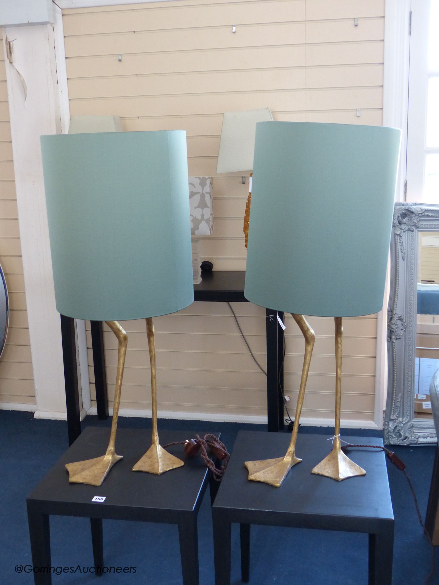 A pair of gilt composition 'goose leg' table lamps, duck egg shades, total height 93 cm